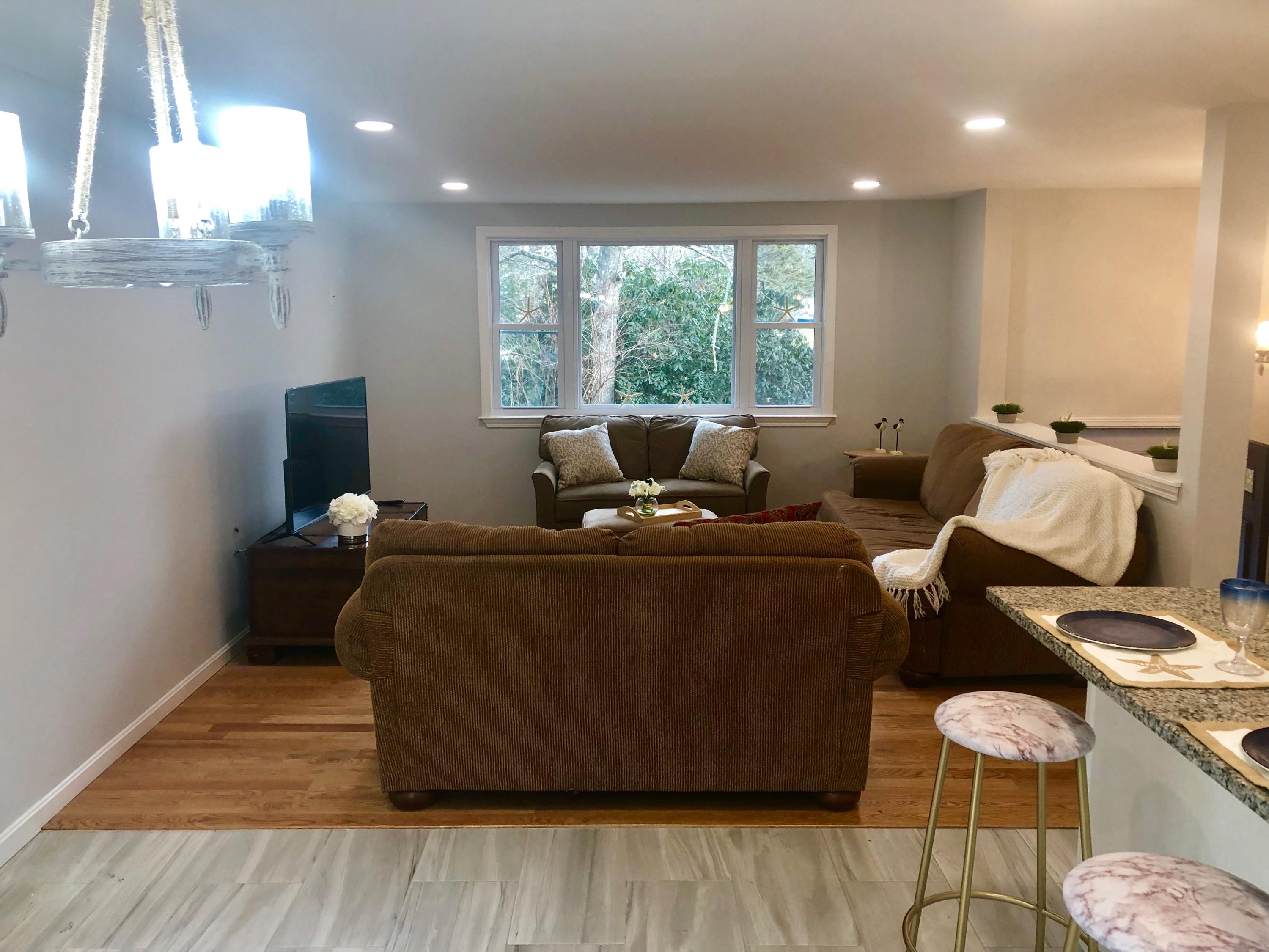57 Stage Coach Road Centerville, MA 02632 - Photo 11 of 34 a living room with furniture and a window