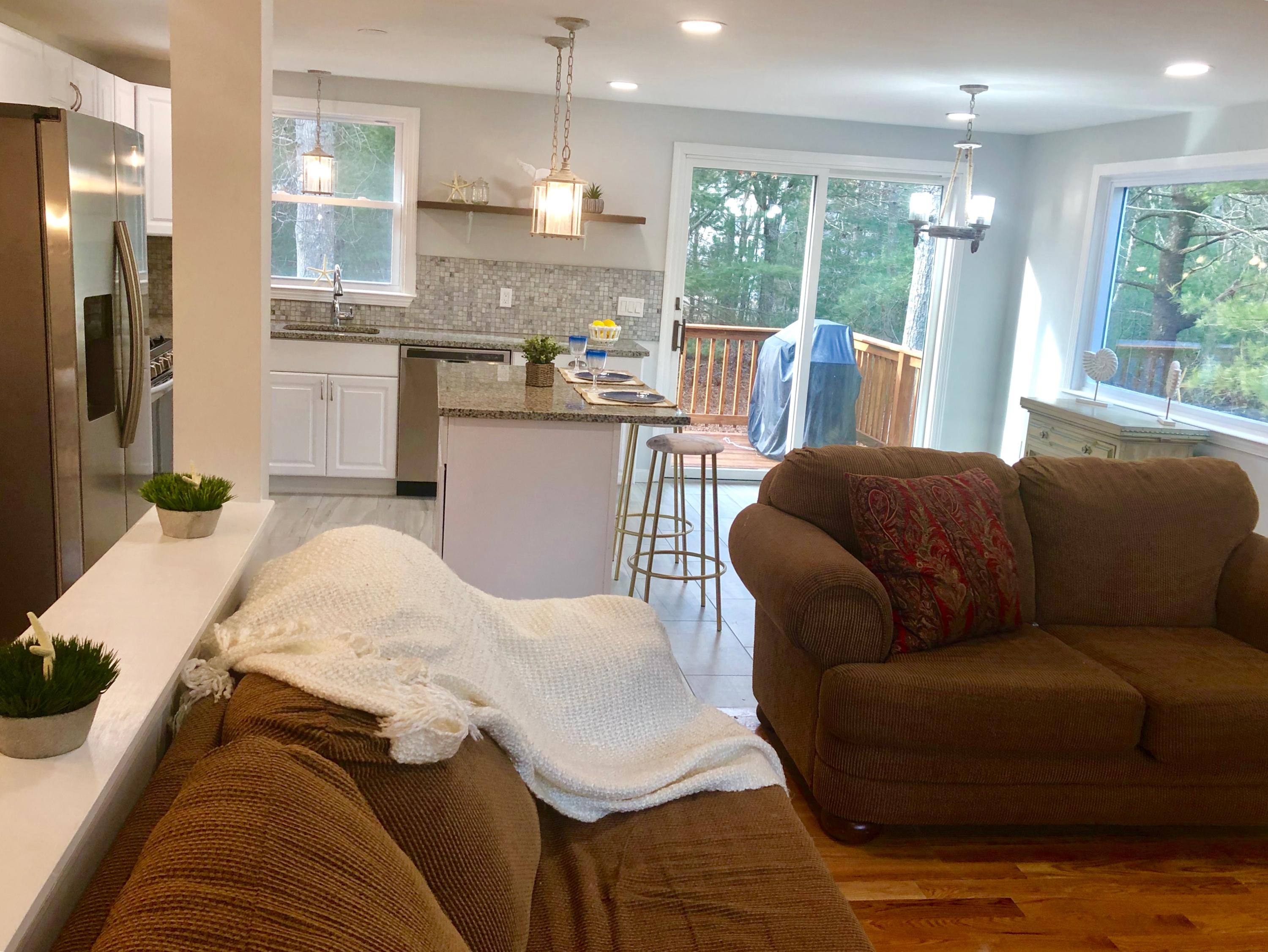 57 Stage Coach Road Centerville, MA 02632 - Photo 14 of 34 a living room with furniture and a large window