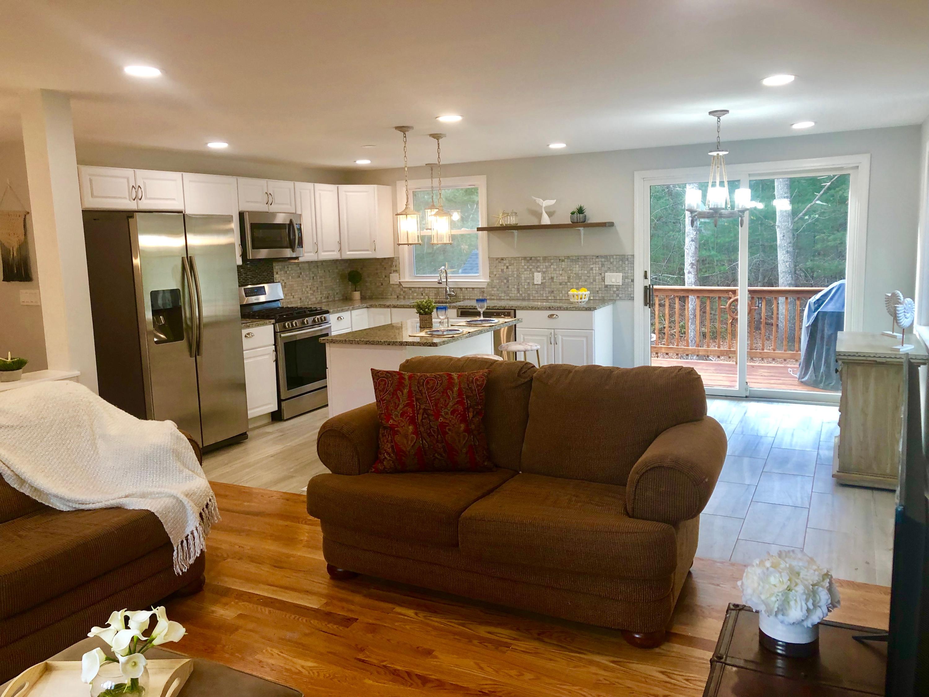 57 Stage Coach Road Centerville, MA 02632 - Photo 15 of 34 a living room with furniture kitchen and a large window