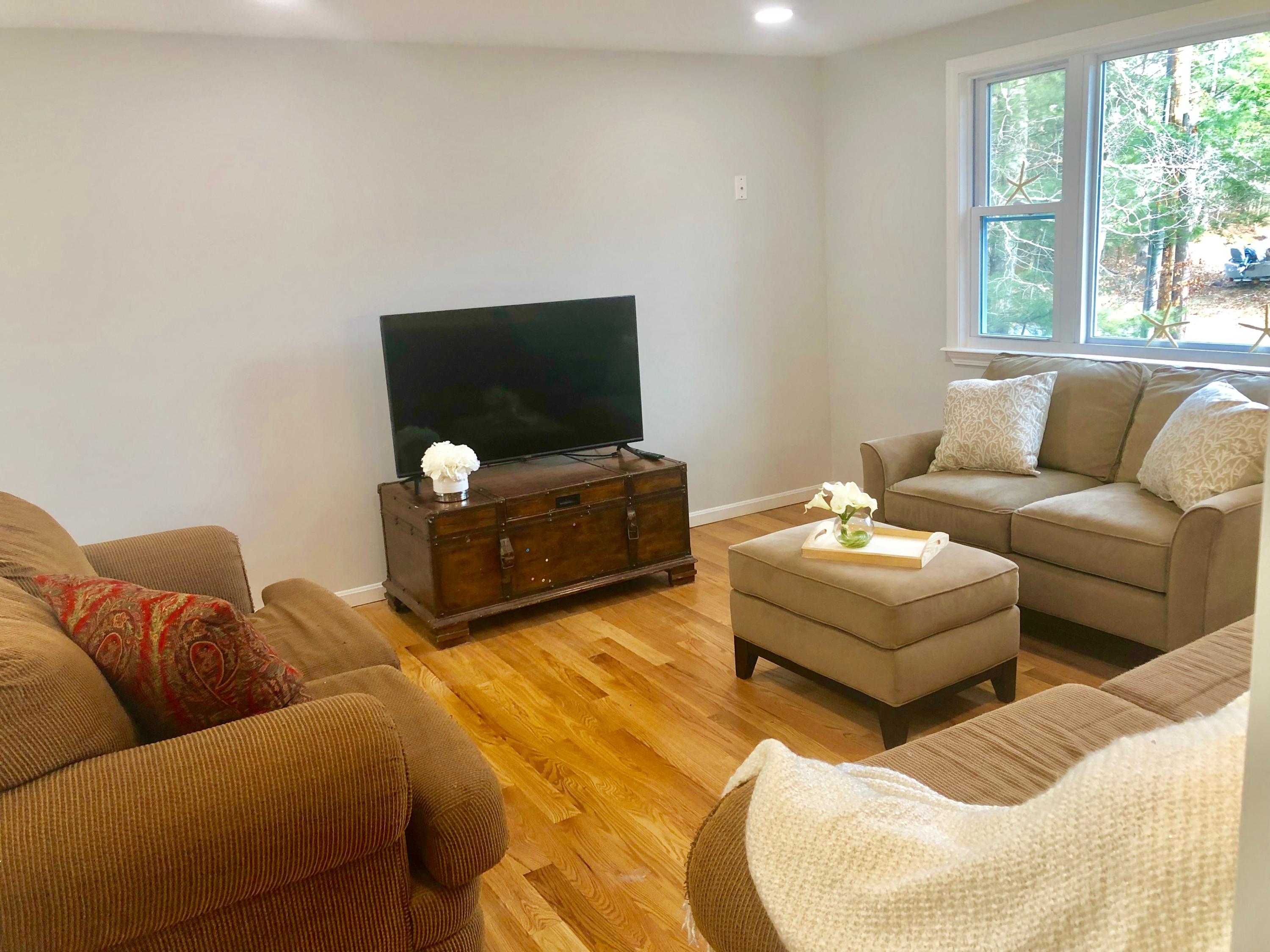 57 Stage Coach Road Centerville, MA 02632 - Photo 17 of 34 a living room with furniture and a flat screen tv