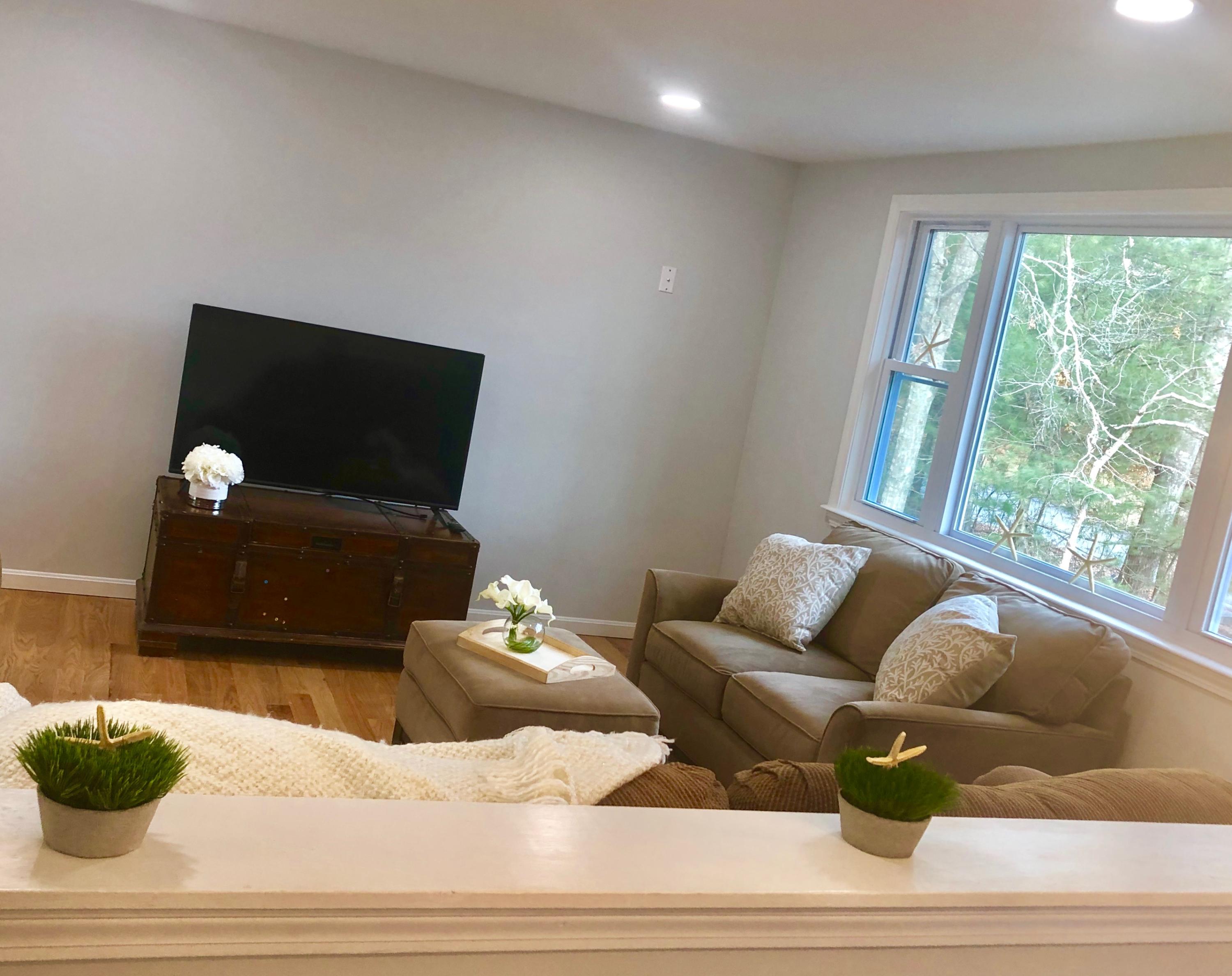 57 Stage Coach Road Centerville, MA 02632 - Photo 18 of 34 a living room with furniture and a flat screen tv