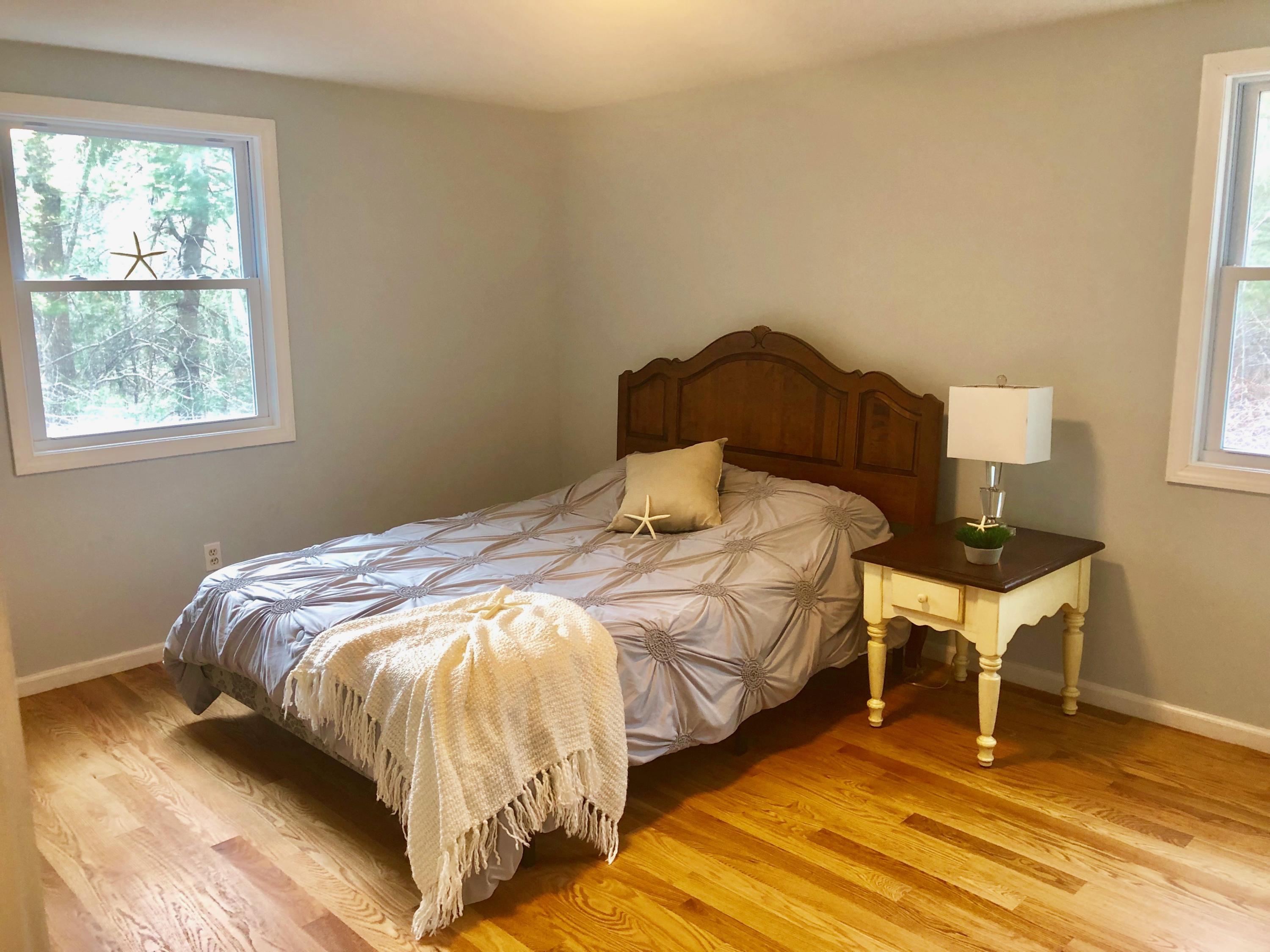 57 Stage Coach Road Centerville, MA 02632 - Photo 19 of 34 a bedroom with a bed and window