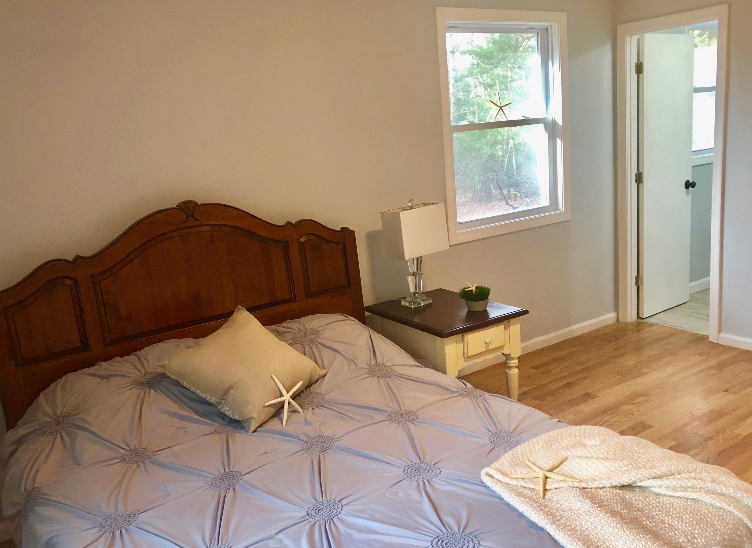 57 Stage Coach Road Centerville, MA 02632 - Photo 21 of 34 a bedroom with a bed and a window