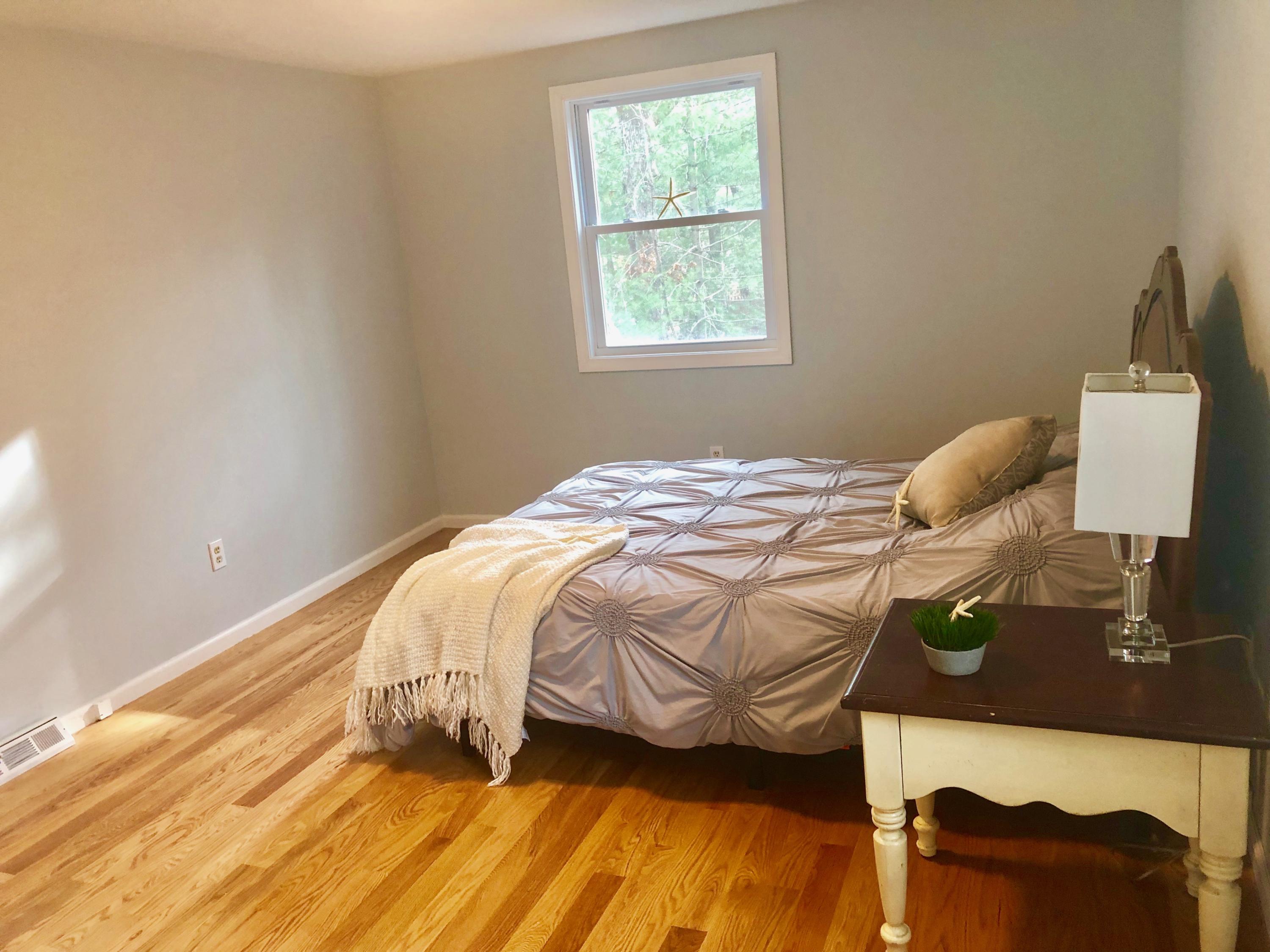 57 Stage Coach Road Centerville, MA 02632 - Photo 22 of 34 a bedroom with a bed and a window