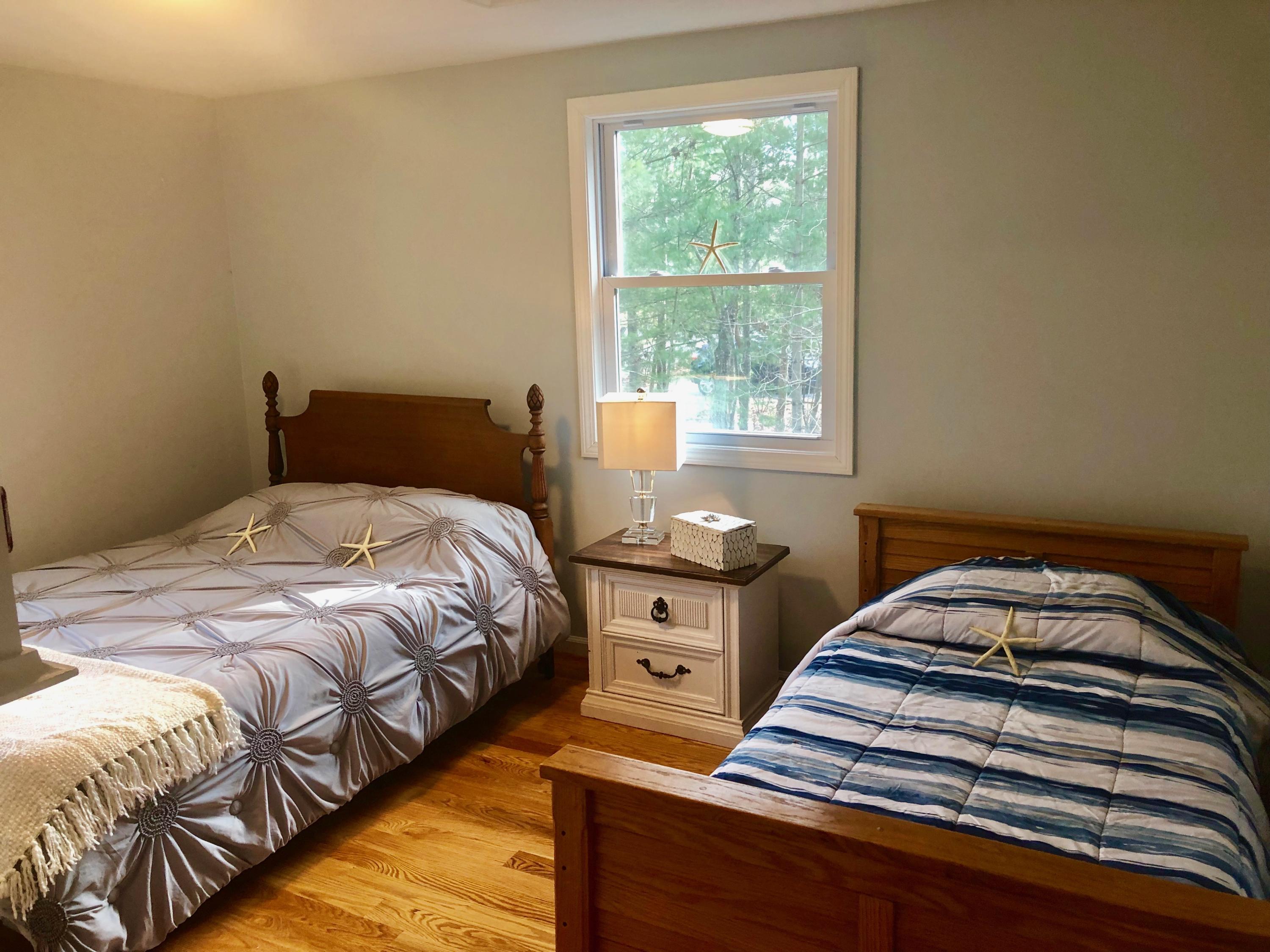 57 Stage Coach Road Centerville, MA 02632 - Photo 25 of 34 a bedroom with a bed and a window