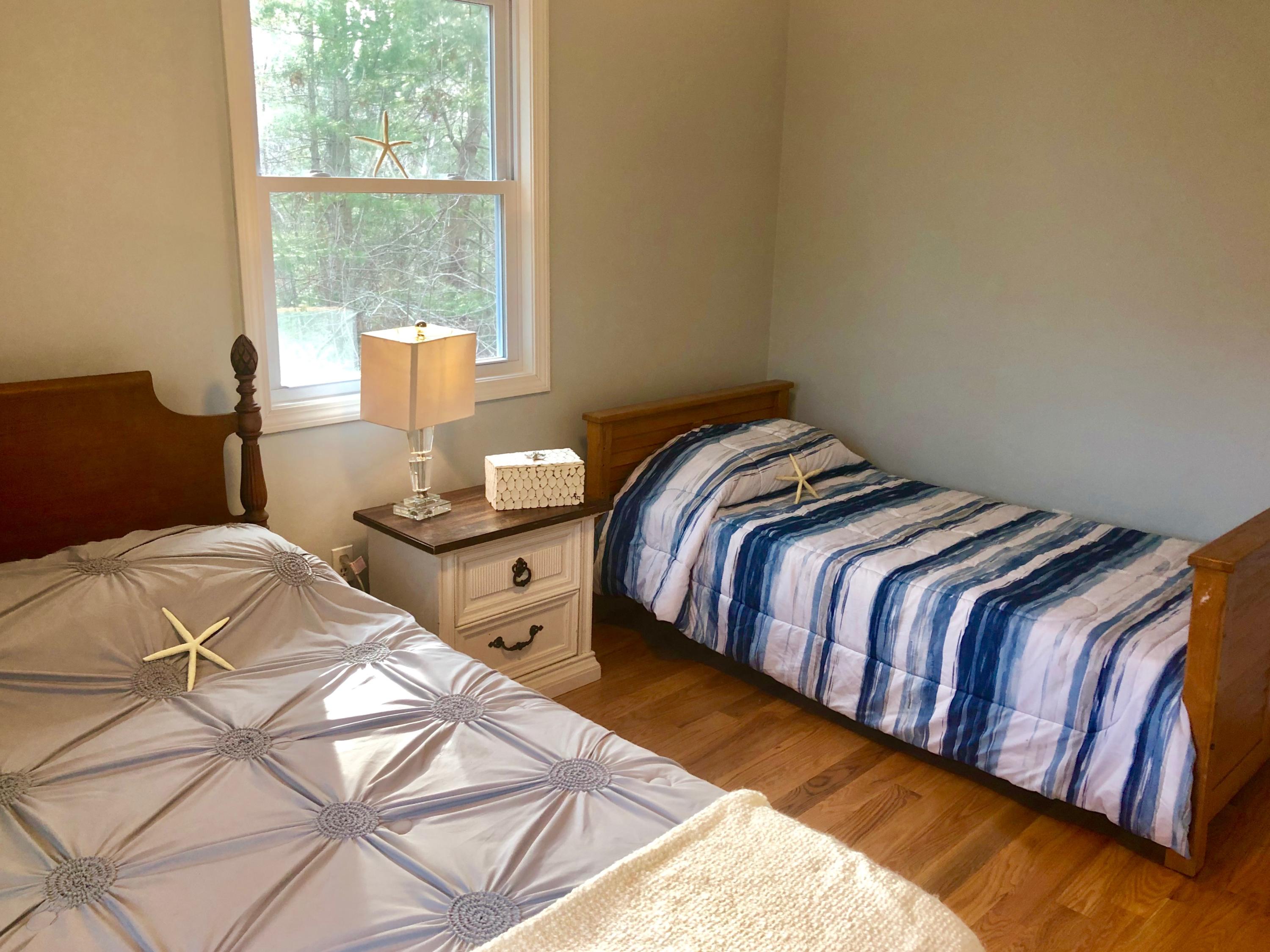 57 Stage Coach Road Centerville, MA 02632 - Photo 26 of 34 a bedroom with two bed and a window