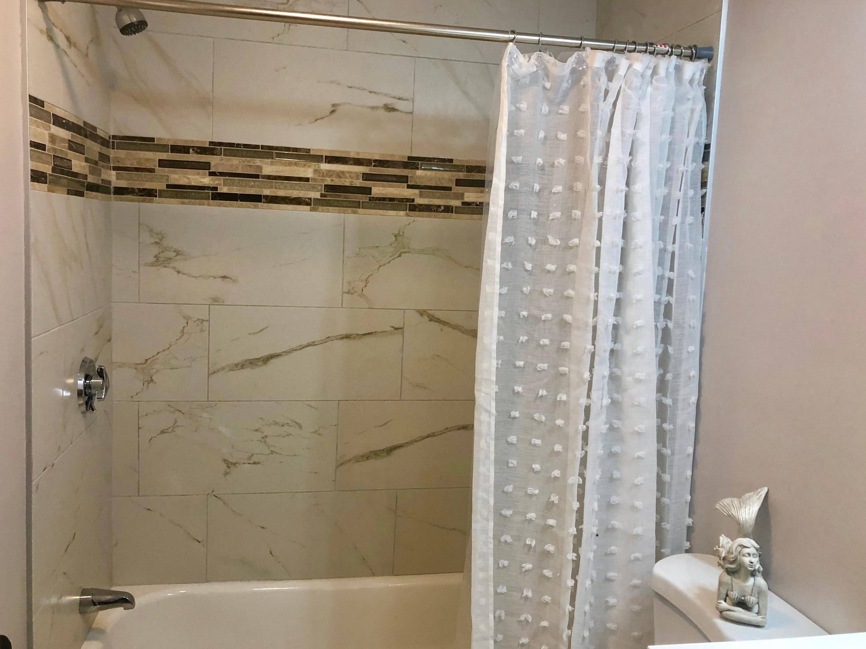 57 Stage Coach Road Centerville, MA 02632 - Photo 27 of 34 a bathroom with a shower