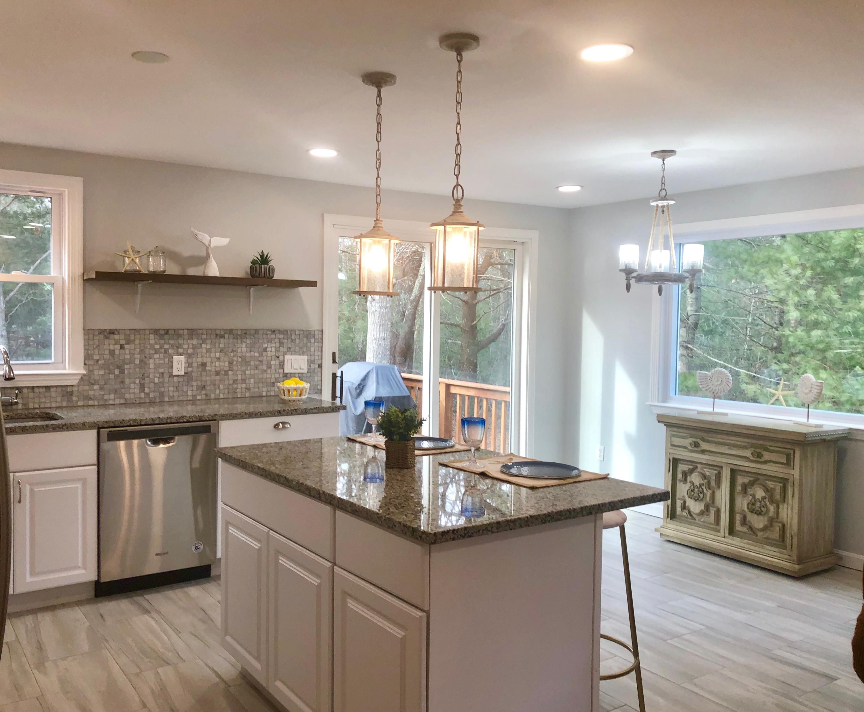 57 Stage Coach Road Centerville, MA 02632 - Photo 4 of 34 a kitchen with center island wooden floor and a wooden floors