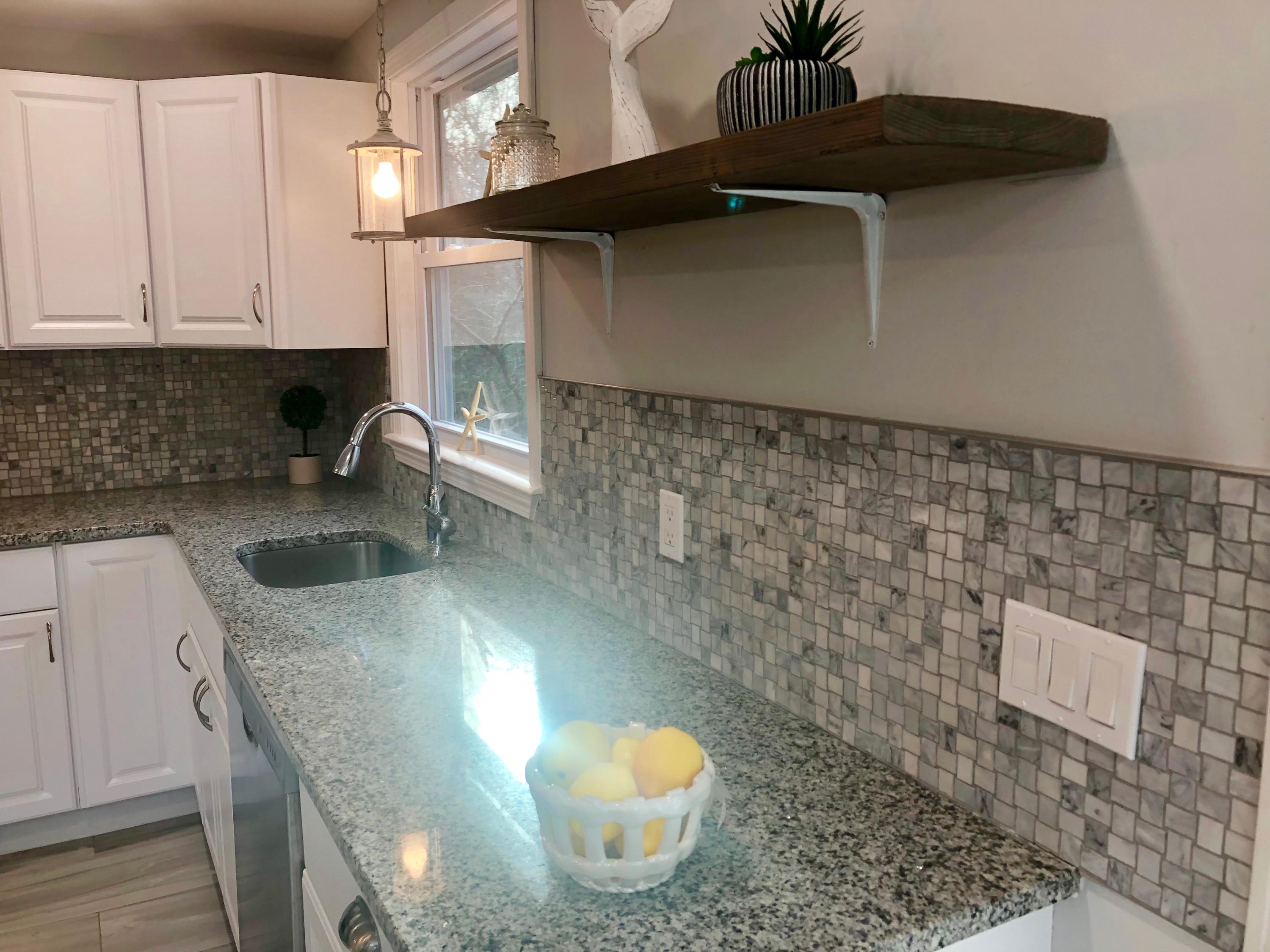 57 Stage Coach Road Centerville, MA 02632 - Photo 7 of 34 a kitchen with a sink a stove and cabinets