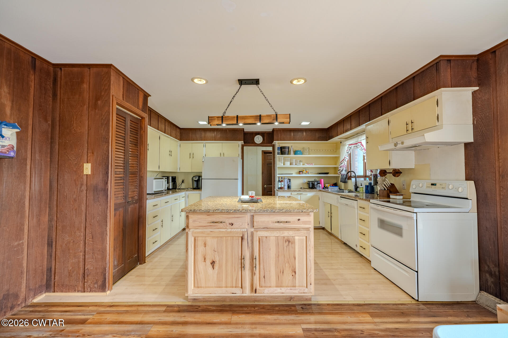 428 Gwin Cemetery Road Waverly, TN 37185 - Photo 13 of 50 a kitchen with stainless steel appliances kitchen island granite countertop a refrigerator and a stove top oven
