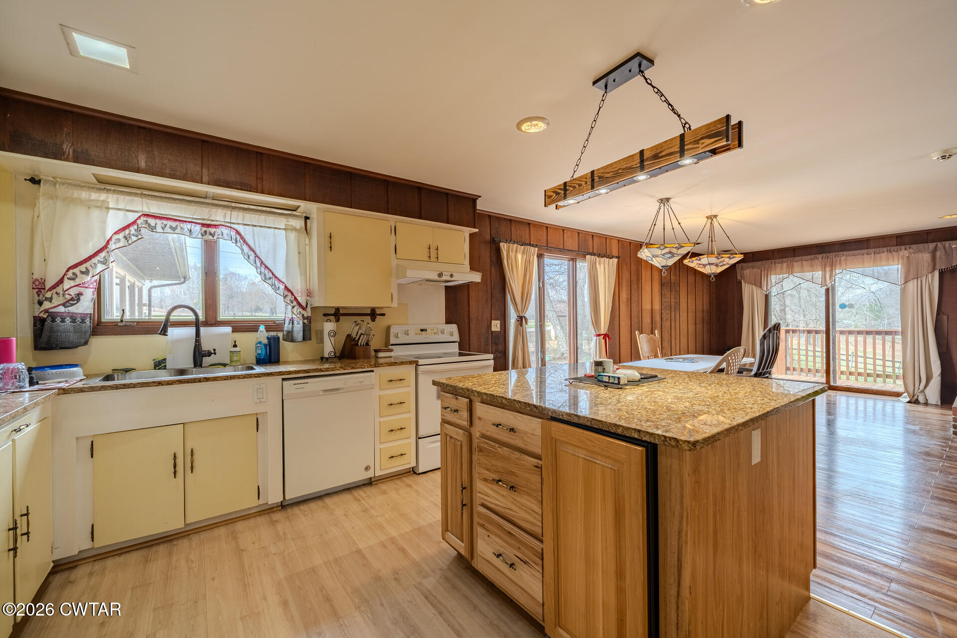 428 Gwin Cemetery Road Waverly, TN 37185 - Photo 15 of 50 a kitchen with a stove a sink and a refrigerator