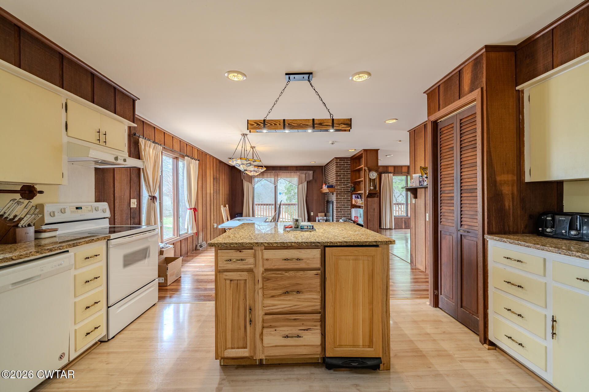 428 Gwin Cemetery Road Waverly, TN 37185 - Photo 16 of 50 a kitchen with stainless steel appliances granite countertop a stove and a refrigerator