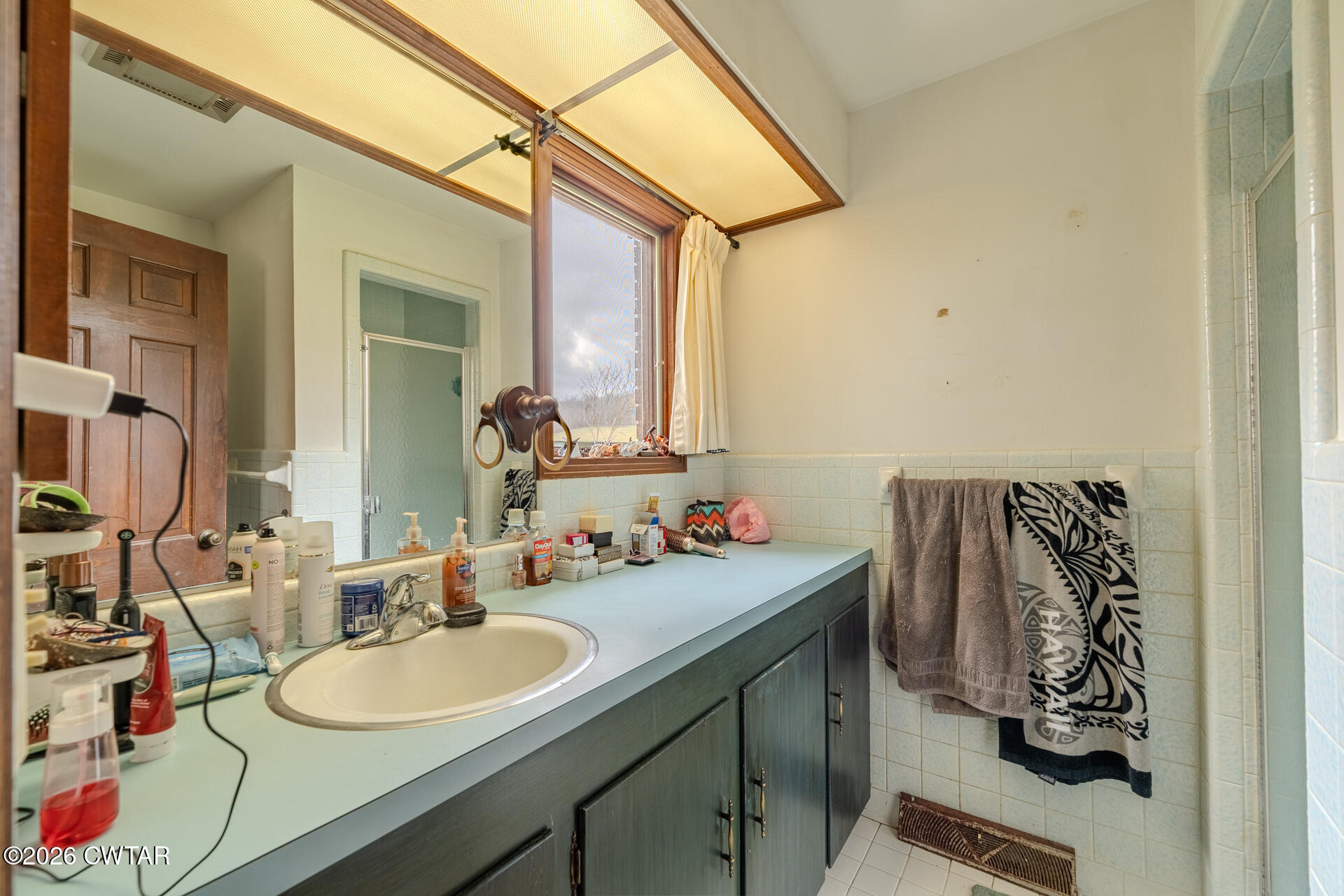 428 Gwin Cemetery Road Waverly, TN 37185 - Photo 20 of 50 a bathroom with a sink double vanity and a mirror