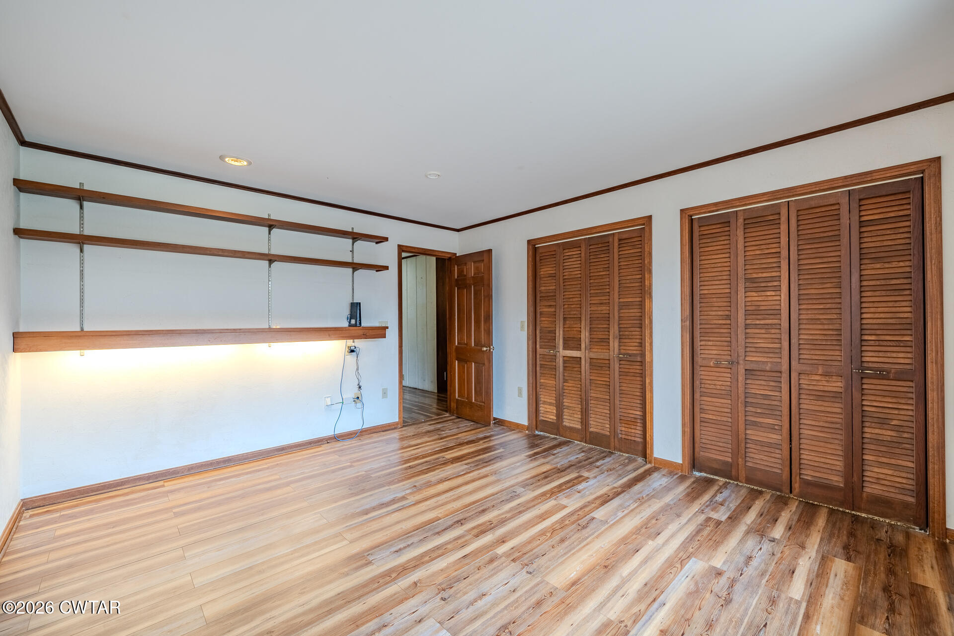 428 Gwin Cemetery Road Waverly, TN 37185 - Photo 22 of 50 a view of empty room with wooden floor and fan