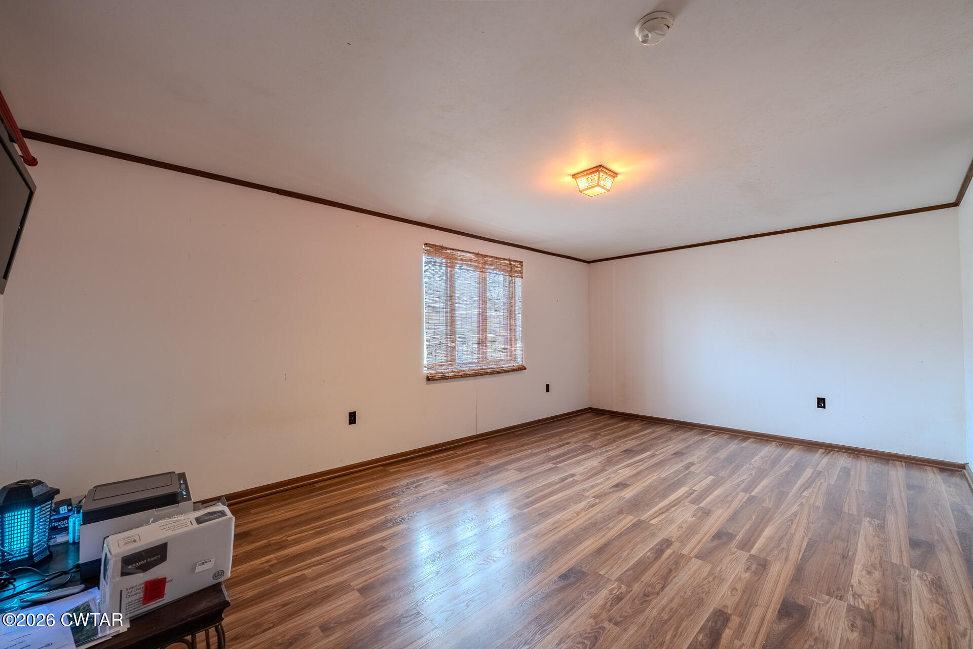 428 Gwin Cemetery Road Waverly, TN 37185 - Photo 28 of 50 a view of an empty room with wooden floor and a window