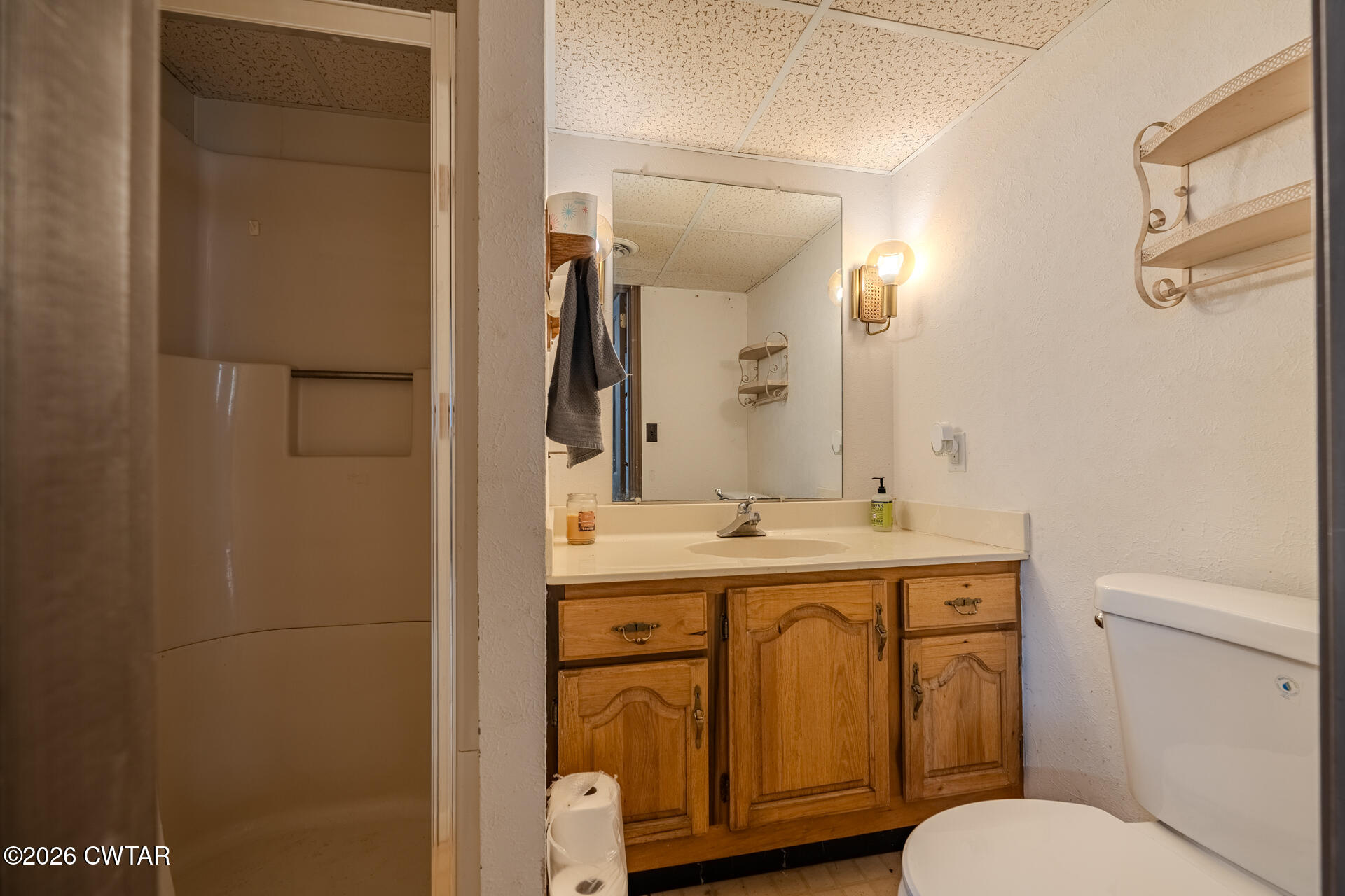 428 Gwin Cemetery Road Waverly, TN 37185 - Photo 30 of 50 a bathroom with a granite countertop toilet sink and mirror