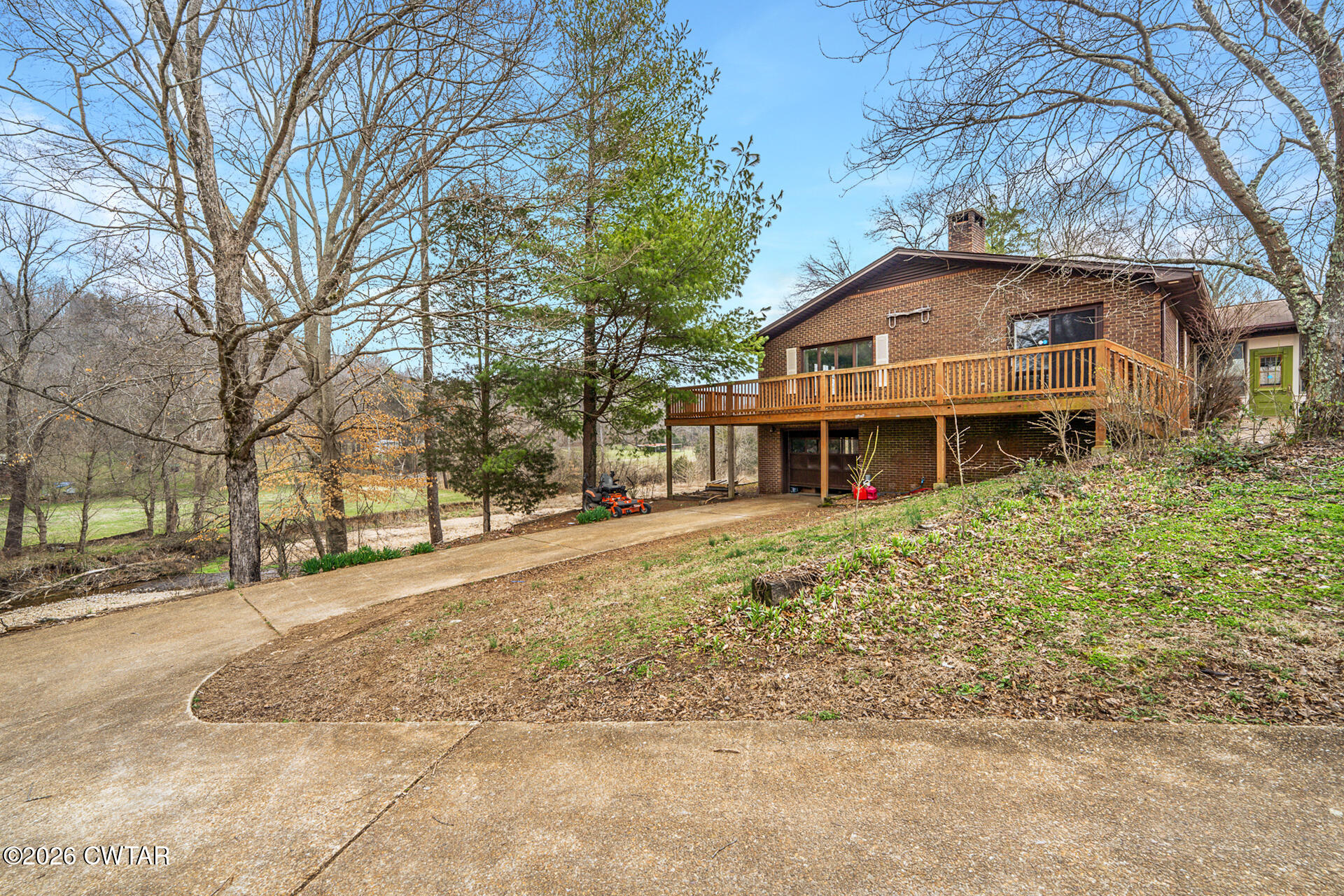 428 Gwin Cemetery Road Waverly, TN 37185 - Photo 42 of 50 a front view of a house with a yard covered in snow