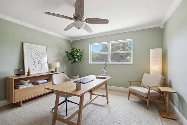 a workspace with furniture and window