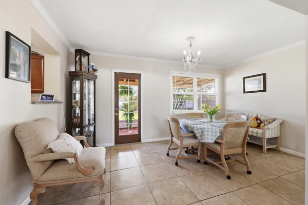 a dining room with furniture and window