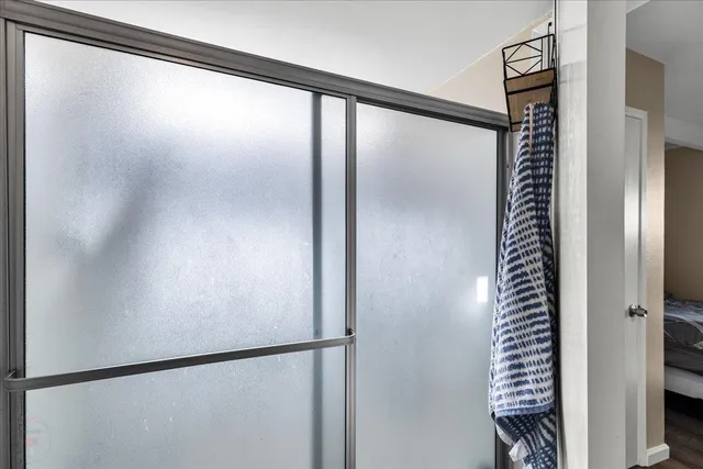 a bedroom with a sink and a mirror