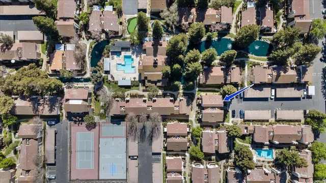 a view of a house with backyard porch and sitting area