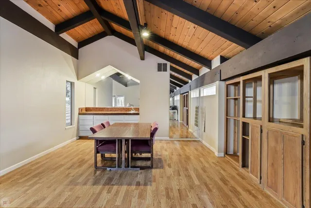 a view of a house with backyard porch and sitting area