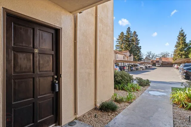 a bedroom with furniture and a mirror
