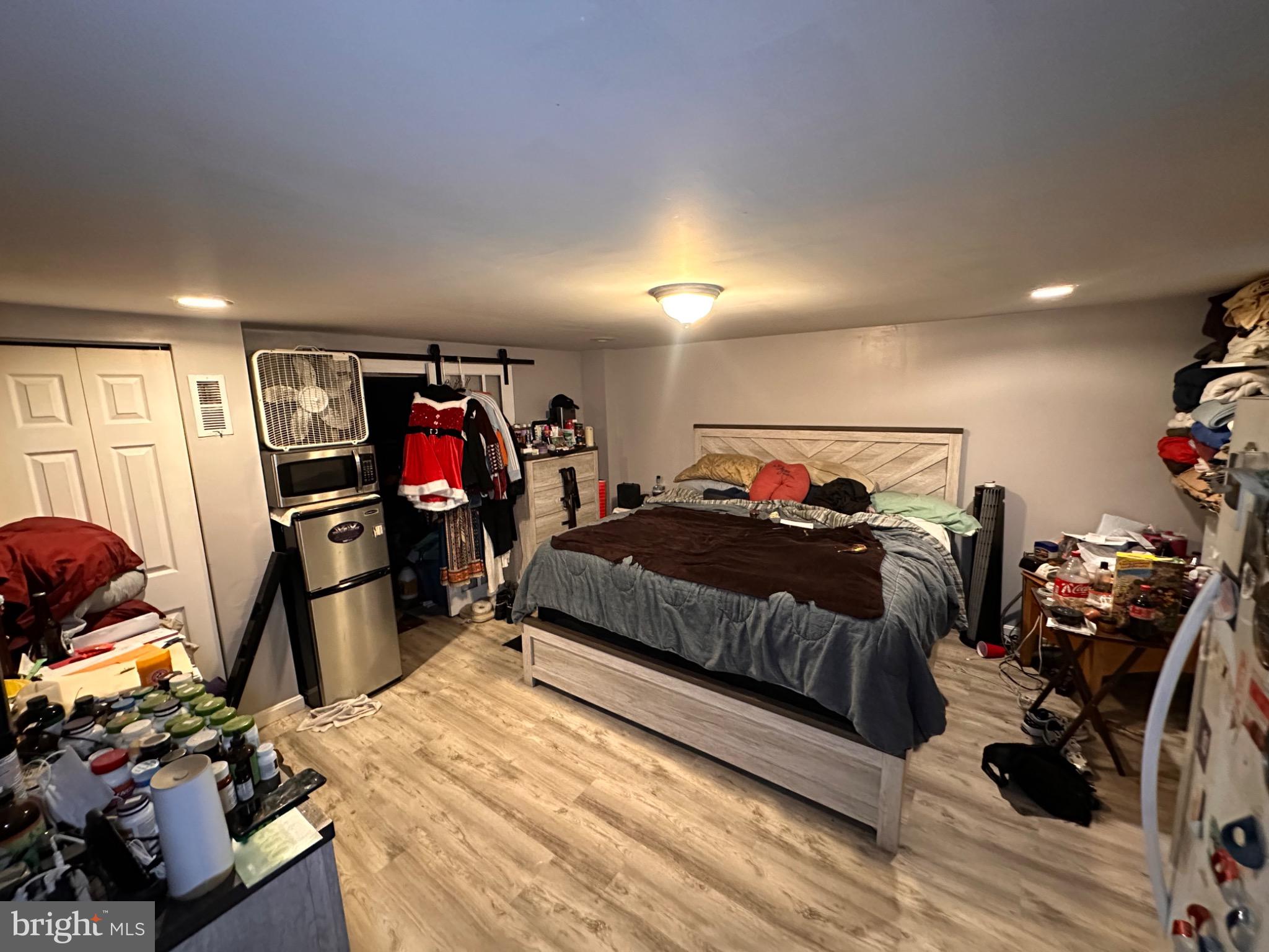 918 Cooks Lane Baltimore, MD 21229 - Photo 15 of 18 a bed room with a bed and a gym equipment