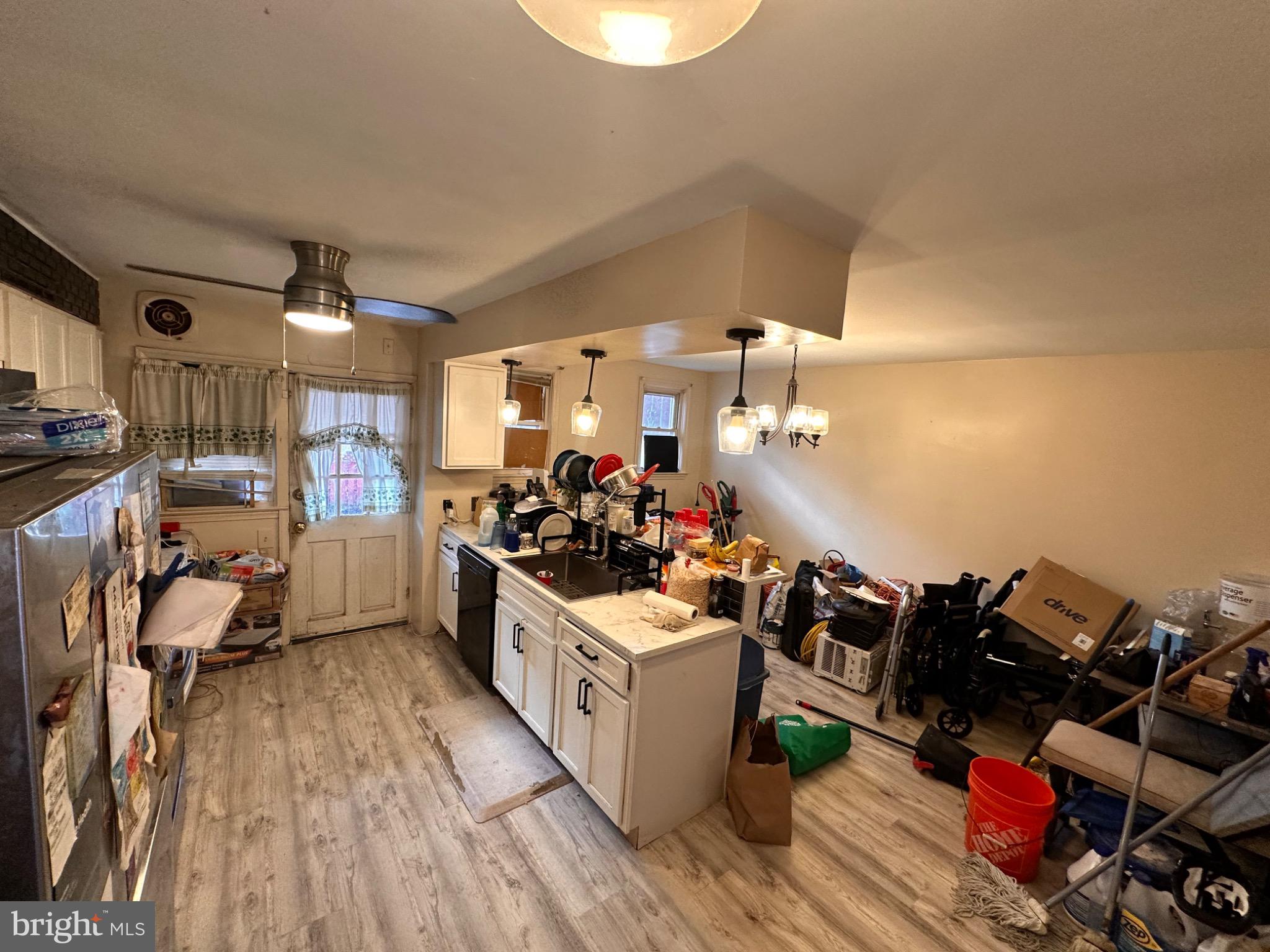 918 Cooks Lane Baltimore, MD 21229 - Photo 5 of 18 a kitchen with a stove and a wooden floor