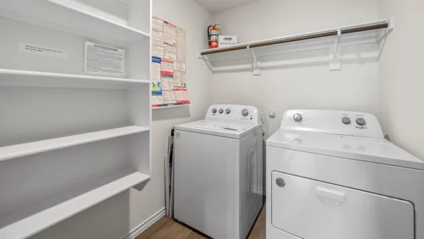 a kitchen with stainless steel appliances granite countertop sink stove top oven and refrigerator