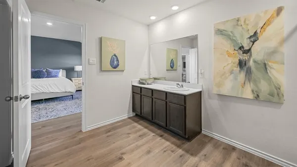 a en suite bathroom with a sink and a mirror