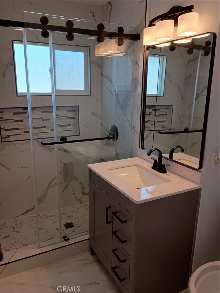 38995 Juniper Tree Road Palmdale, CA 93551 - Photo 13 of 22 a bathroom with a sink and mirror