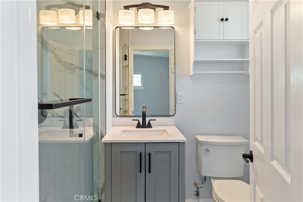 38995 Juniper Tree Road Palmdale, CA 93551 - Photo 14 of 22 a bathroom with a sink a toilet and shower