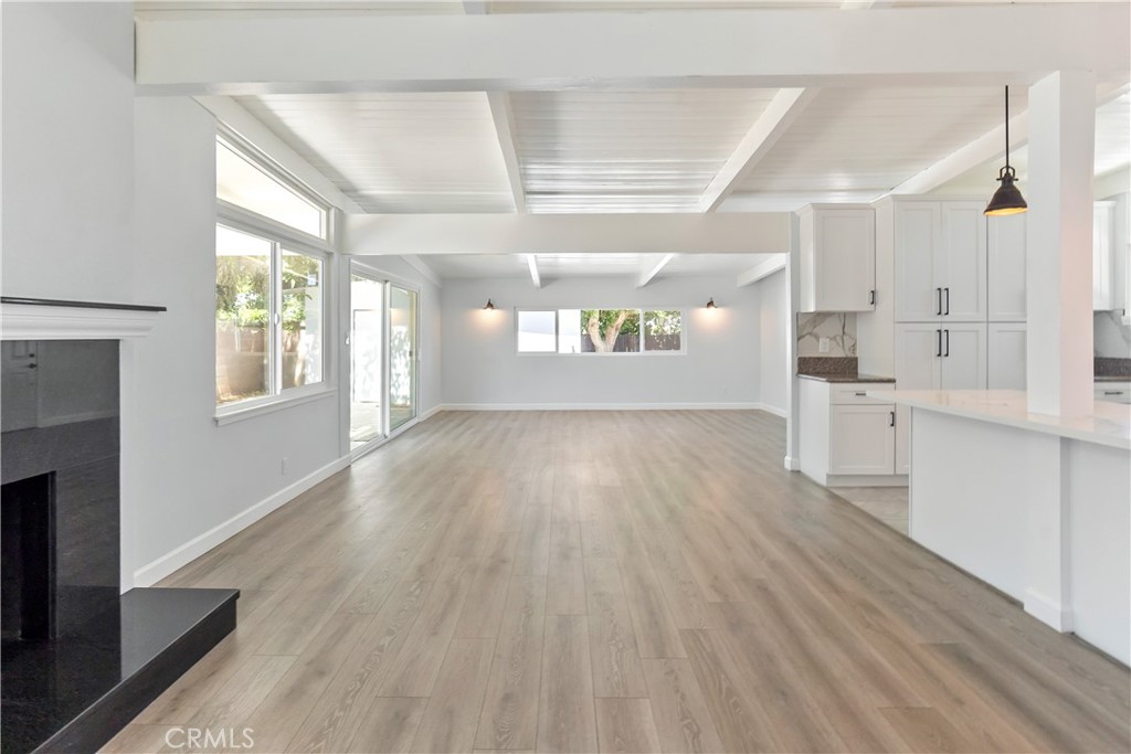 38995 Juniper Tree Road Palmdale, CA 93551 - Photo 19 of 22 a view of an empty room with window and wooden floor