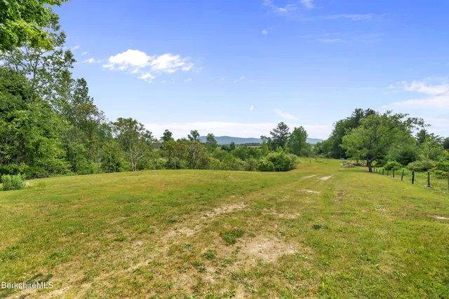 a view of an ocean and a yard