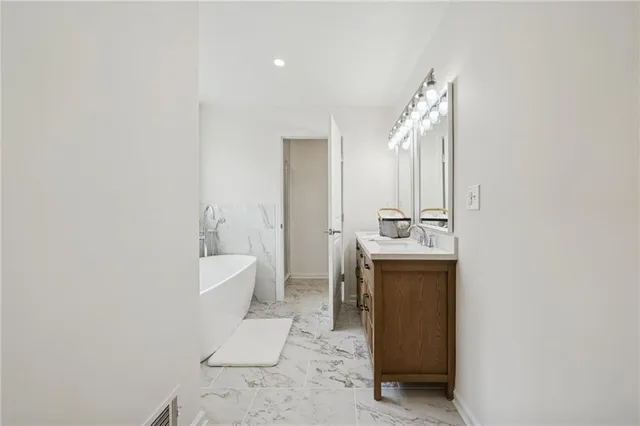 a room with a sink and a mirror