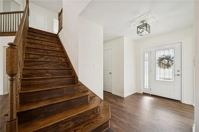 a view of an entryway with wooden floor
