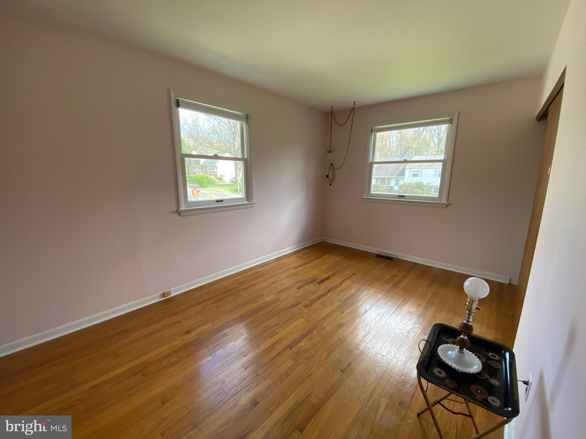 123 Cornwall Drive Chalfont, PA 18914 - Photo 13 of 37 a view of empty room with wooden floor and fan