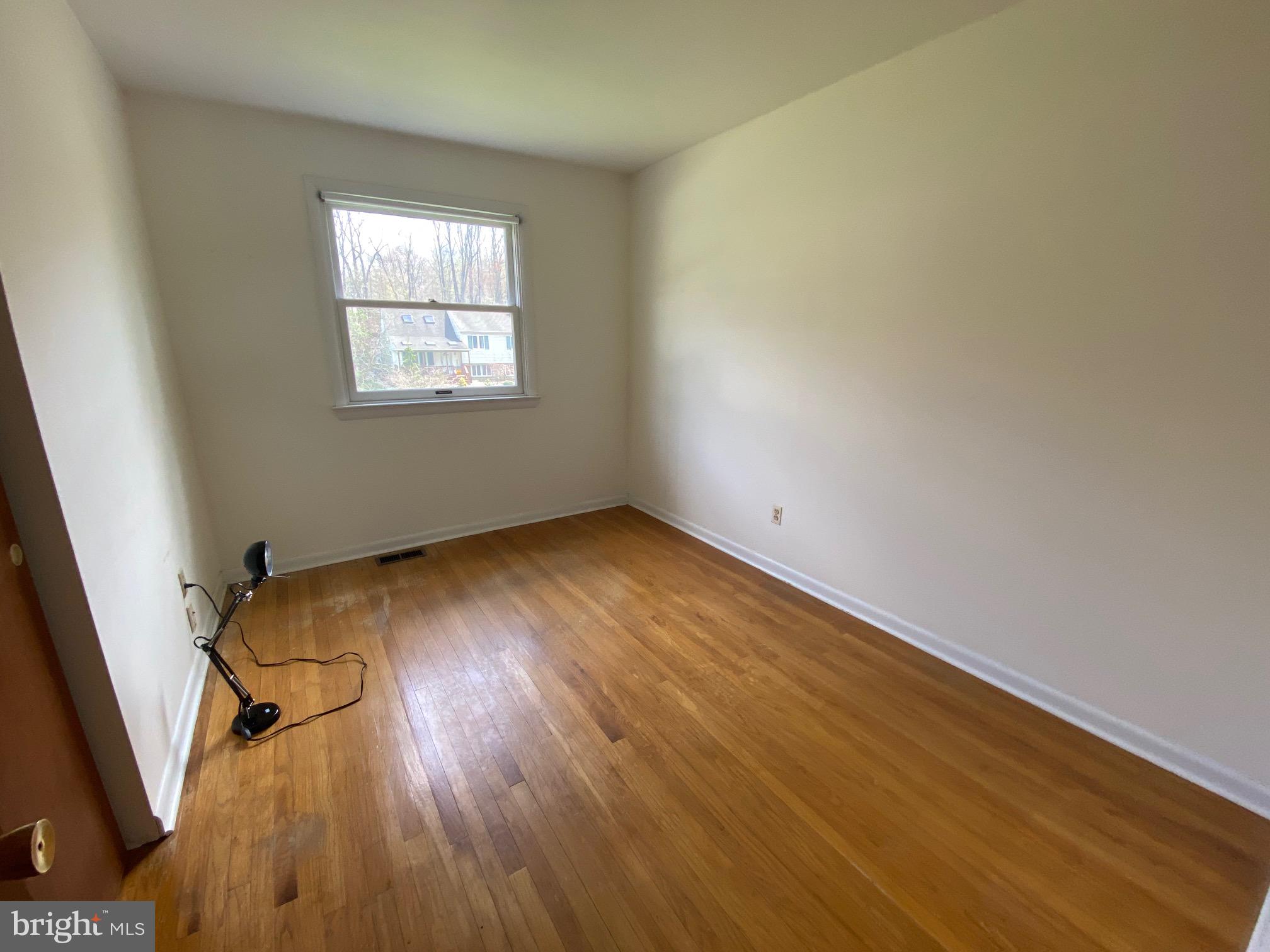 123 Cornwall Drive Chalfont, PA 18914 - Photo 15 of 37 an empty room with wooden floor and windows