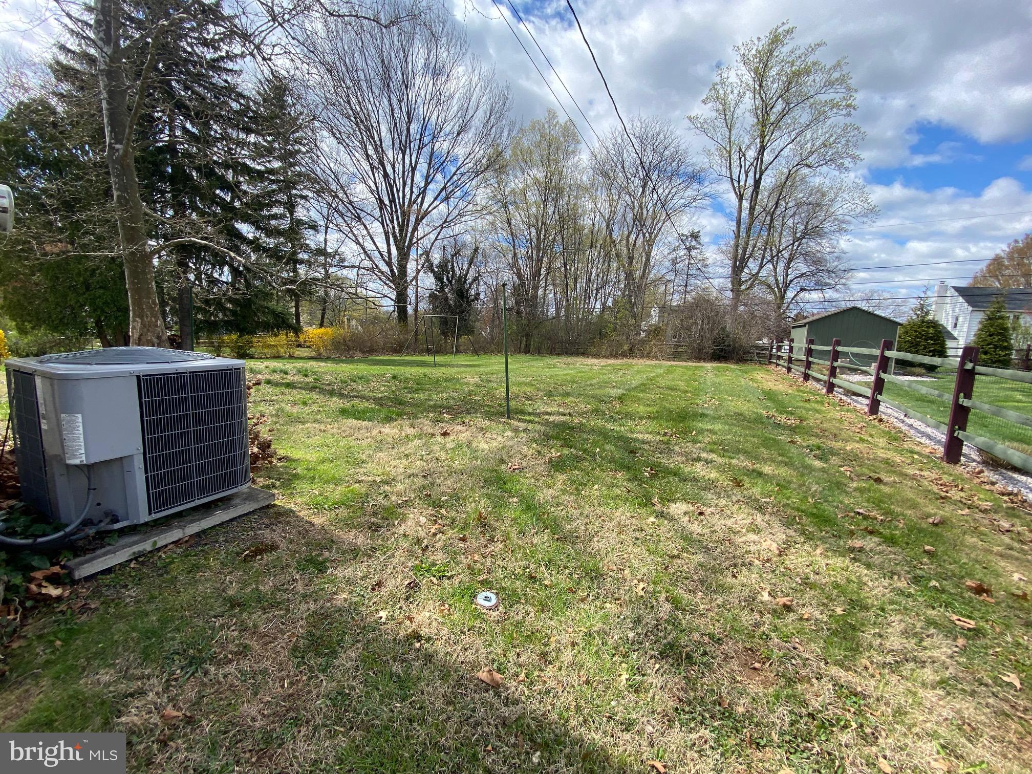 123 Cornwall Drive Chalfont, PA 18914 - Photo 29 of 37 a view of a backyard with wooden fence