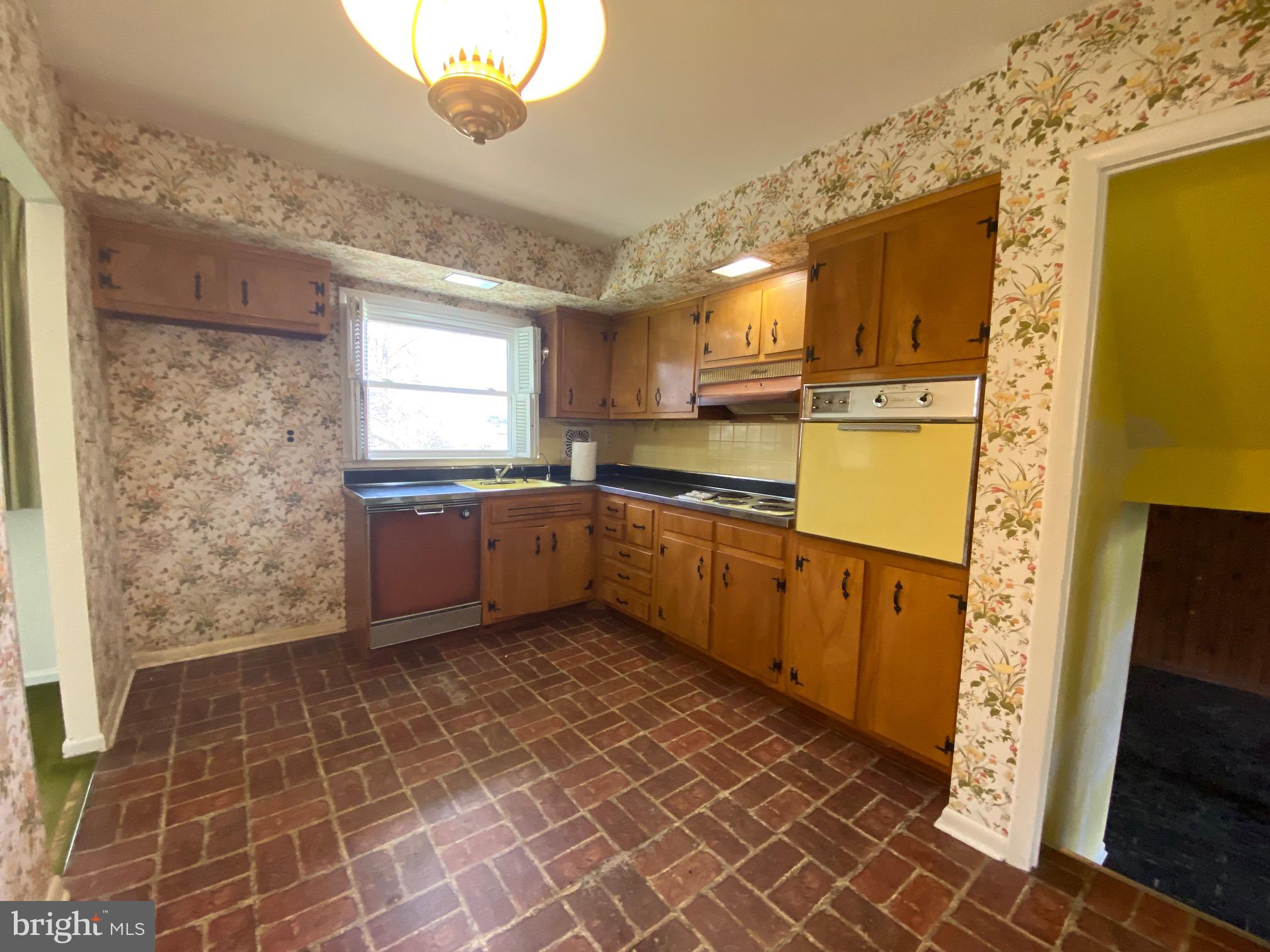 123 Cornwall Drive Chalfont, PA 18914 - Photo 9 of 37 a kitchen with stainless steel appliances a sink a stove a refrigerator a window