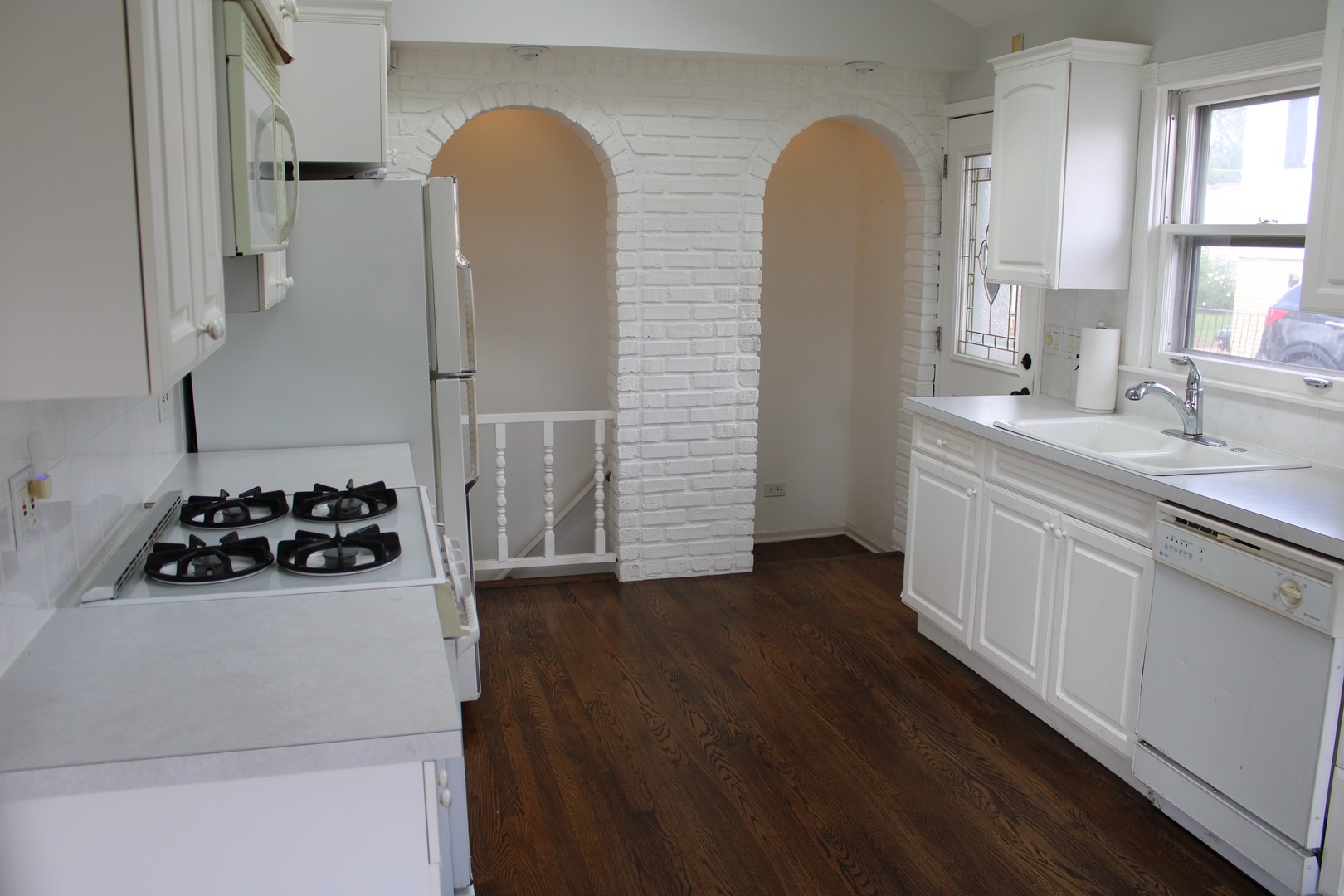 2510 South 17th Avenue Broadview, IL 60155 - Photo 6 of 17 a kitchen with a sink a stove and cabinets