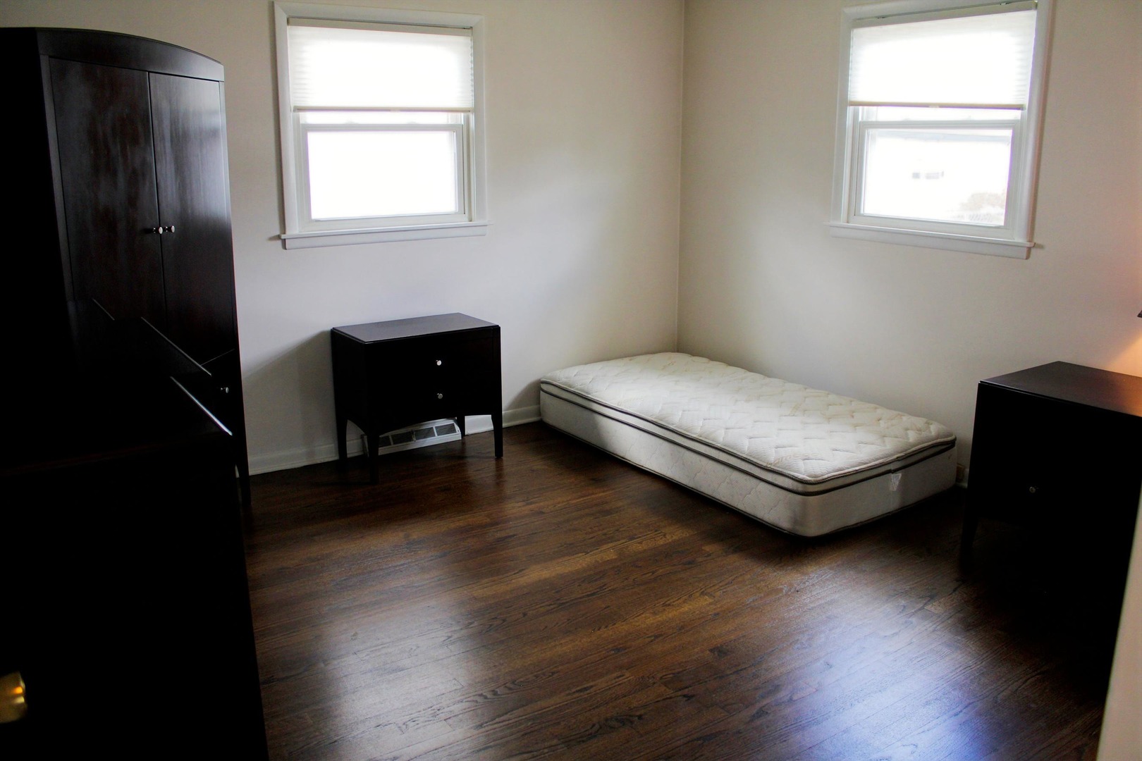 2510 South 17th Avenue Broadview, IL 60155 - Photo 7 of 17 a bedroom with a bed and wooden floor