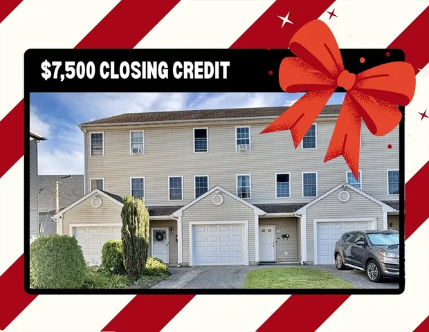 a view of multiple houses with a street