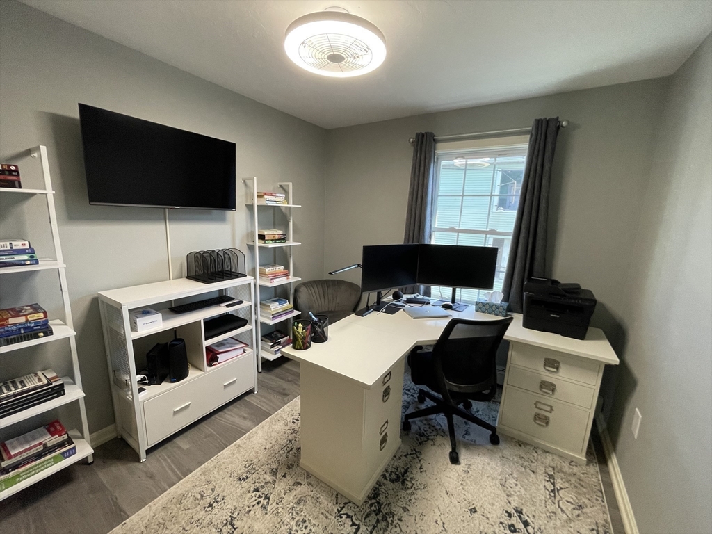 33 Sigel Street, Unit B Worcester, MA 01610 - Photo 19 of 28 a living room with furniture and a flat screen tv