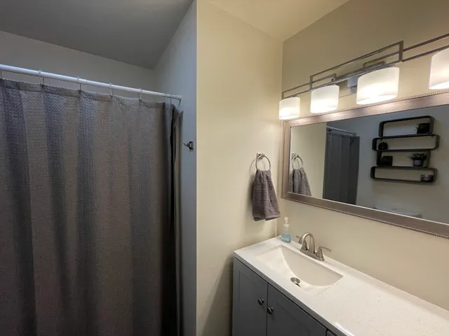 a bathroom with a sink and mirror