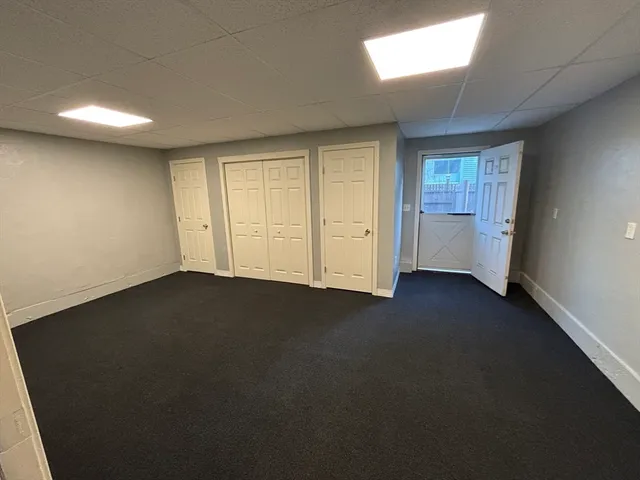 an empty room with a fireplace