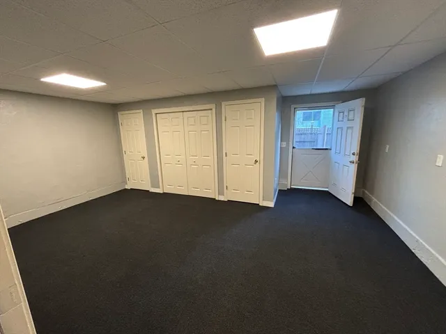 an empty room with a fireplace