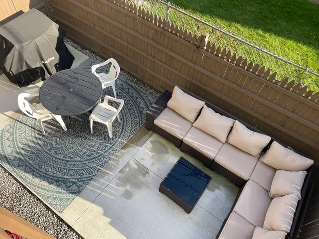 a view of barbeque area with seating