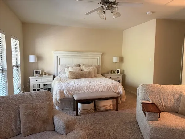 a bedroom with a bed and couch